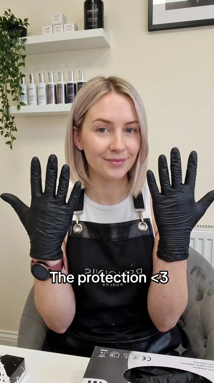 Her hands after several clients, gloves off