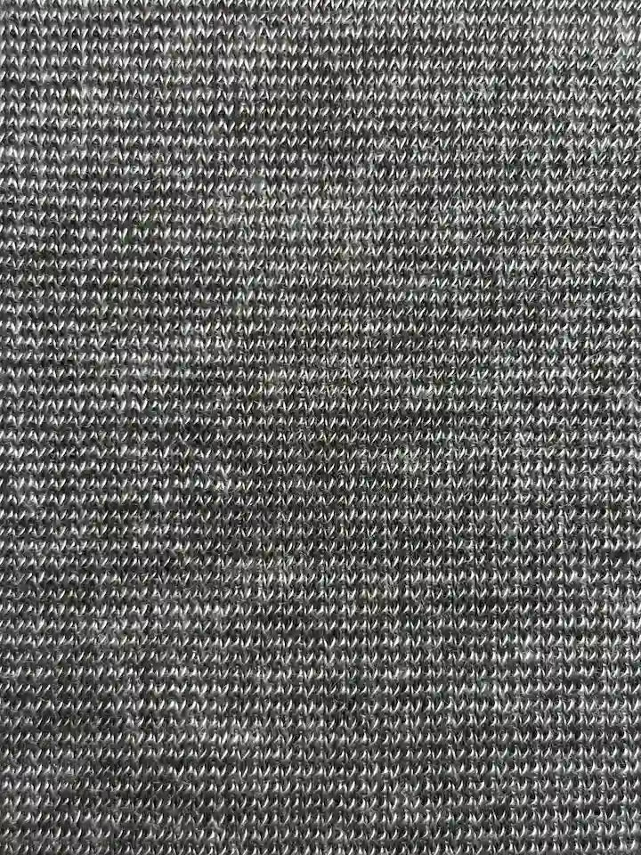Control textile sample with same fibres but different knit, showing minimal wicking area.