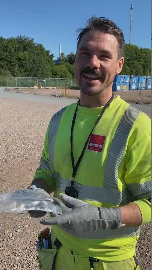 Worker wearing DRYE glove liners