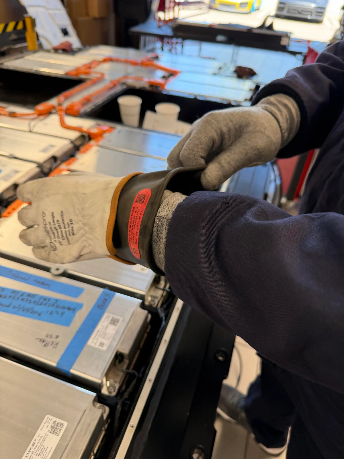 Worker wearing DRYE glove liners